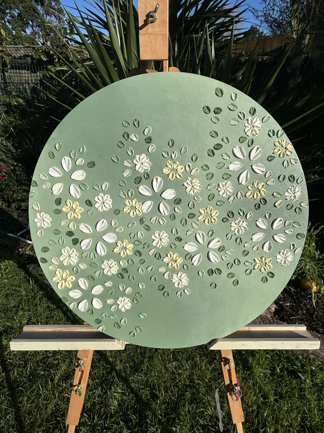 Textured floral painting in sage green