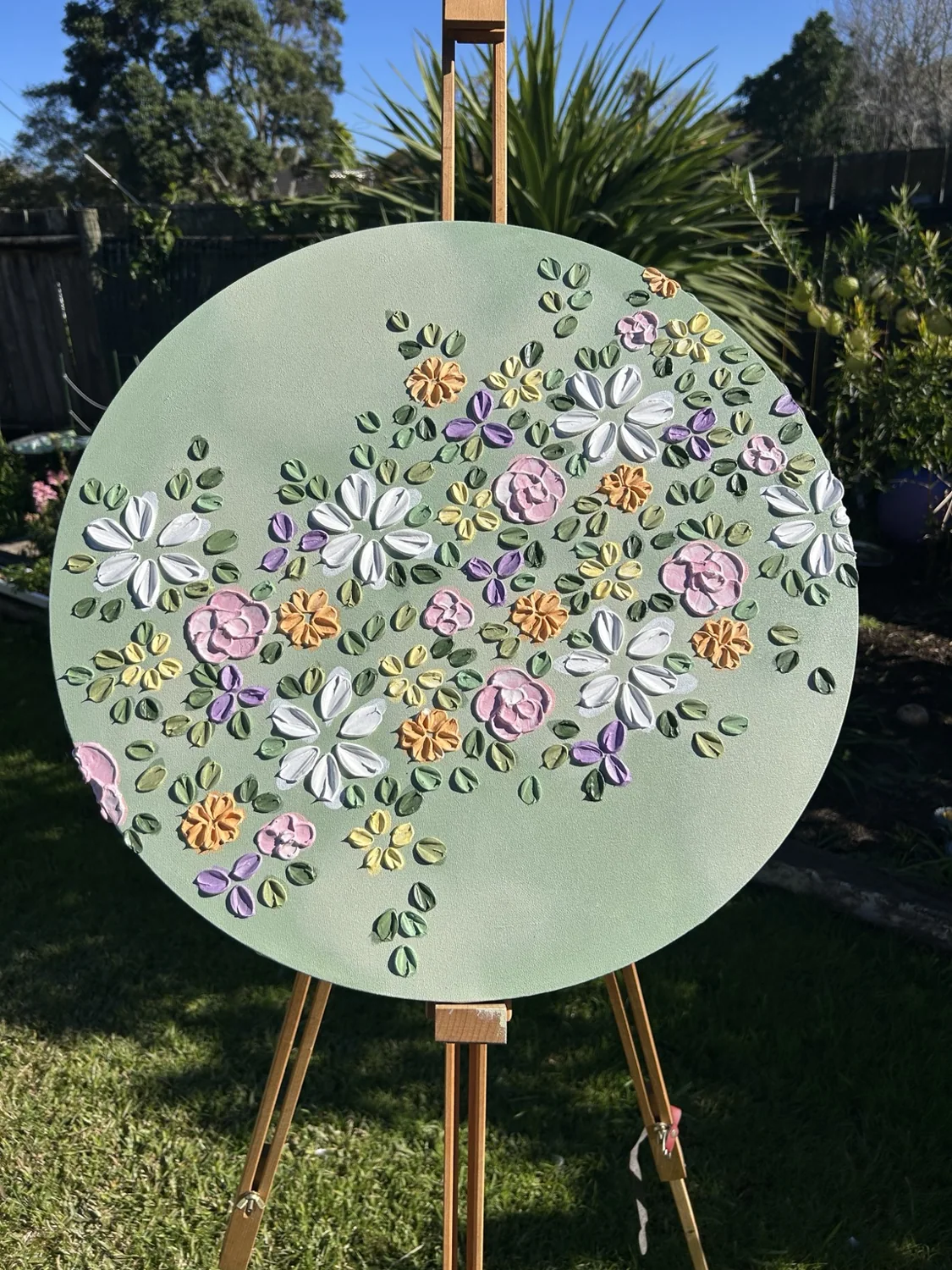 Round textured floral artwork